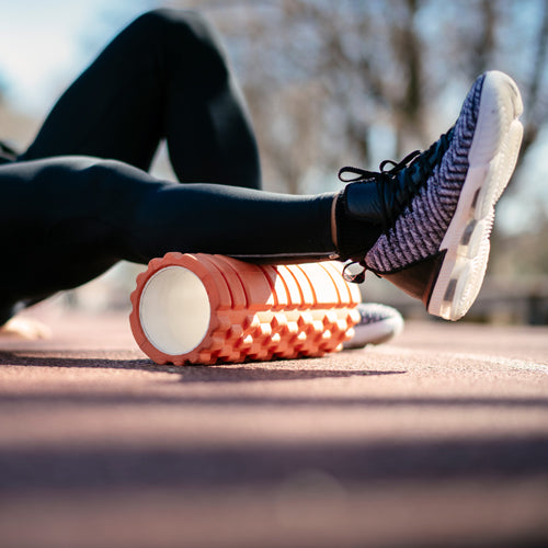 a man is foam rolling for recovery