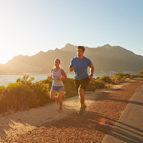 two people are running outdoors