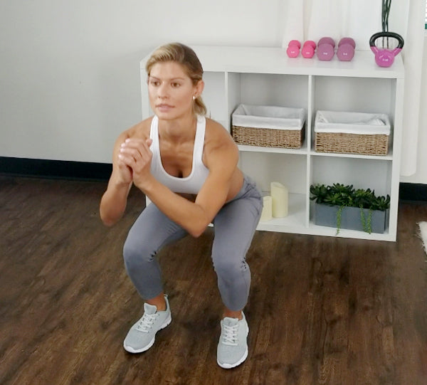 woman performing a squat