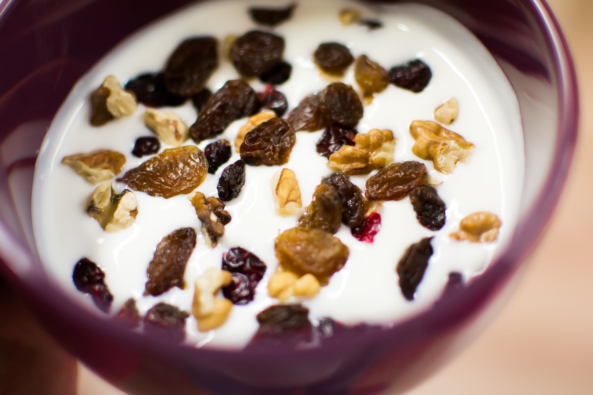 yogurt with raisins and nuts in a bowl