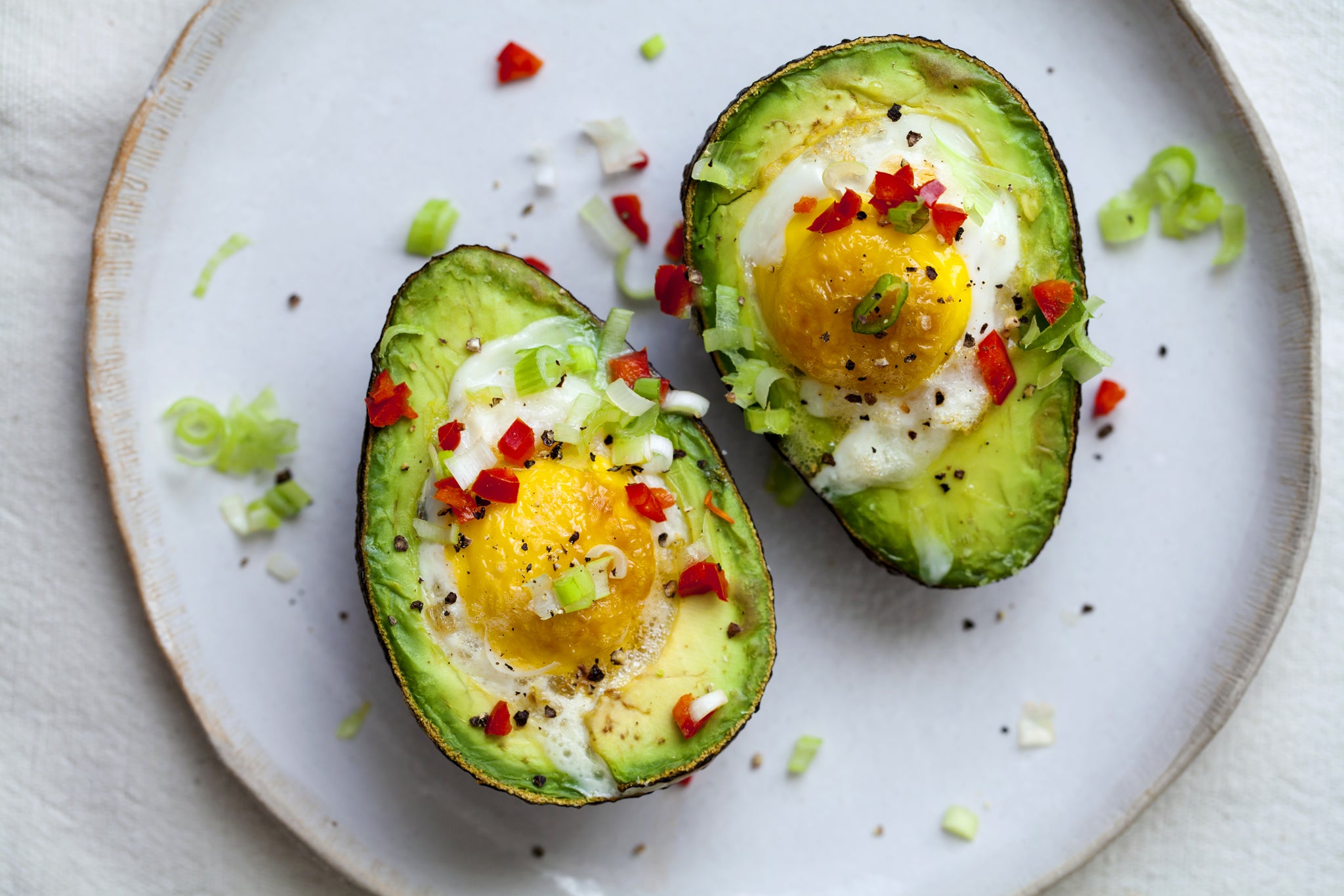 avocado halves with eggs in the middle