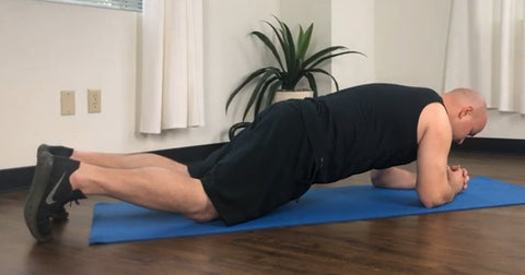 Man demonstrating modified plank hold workout