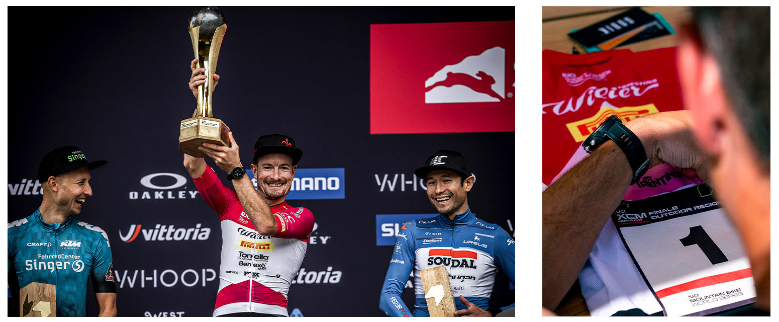 Fabian sur le podium, soulevant le trophée de leader de la Coupe du monde.