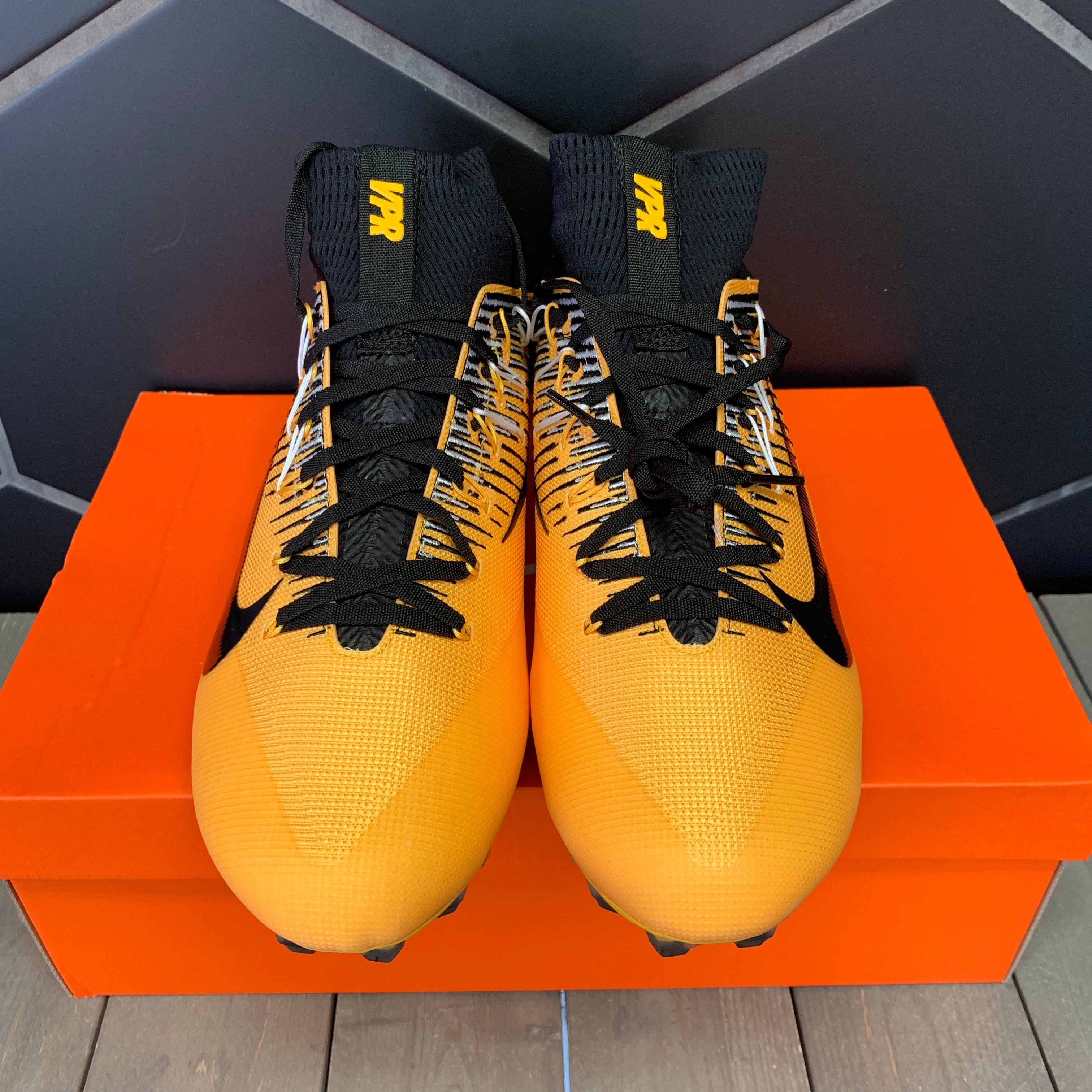 nike gold and black football cleats