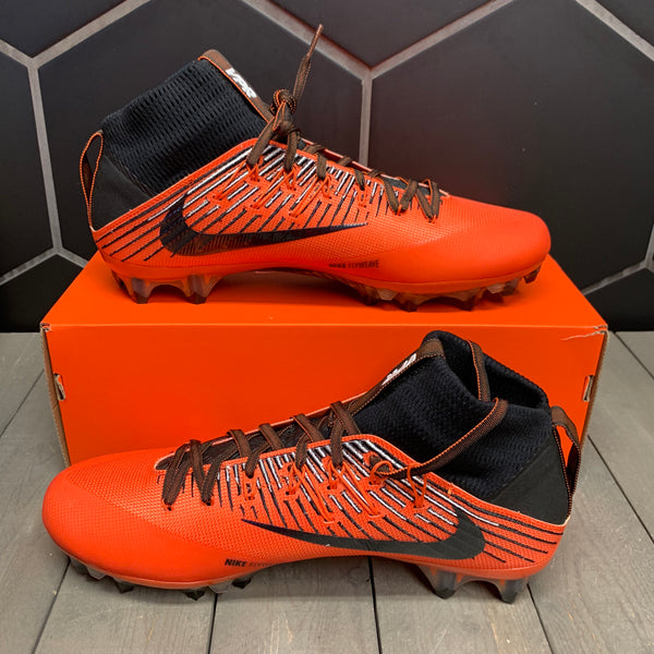 orange and black football cleats