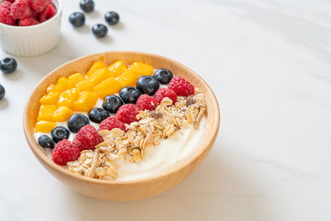 bowl of yogurt with added whey protein powder and fruits