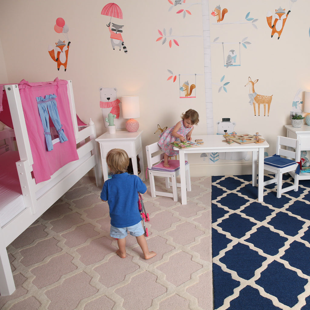 preschool room with bed and furniture