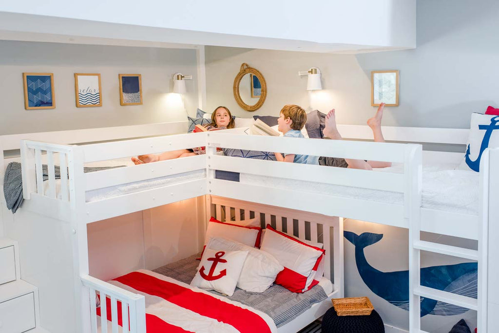 two kids up high on corner bunk bed