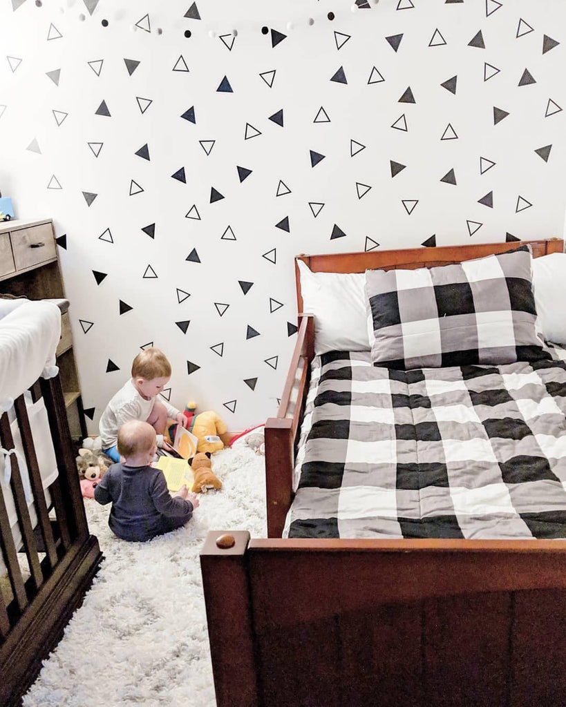 toddler bed now in a shared room