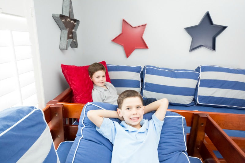 two kids sleeping up high l-shaped loft bed