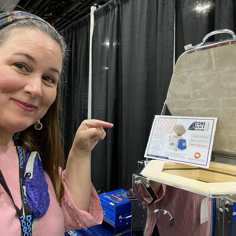 Will it come home with me? Amy Lee stands with a test kiln in hopes of winning it at NCECA 2023 Cincinnati Ohio