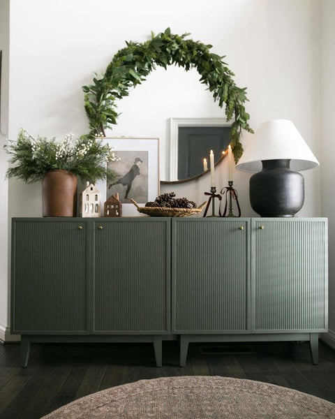 Sideboard with decorative winter wreath