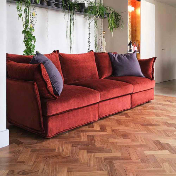 red sofa with plant shelf