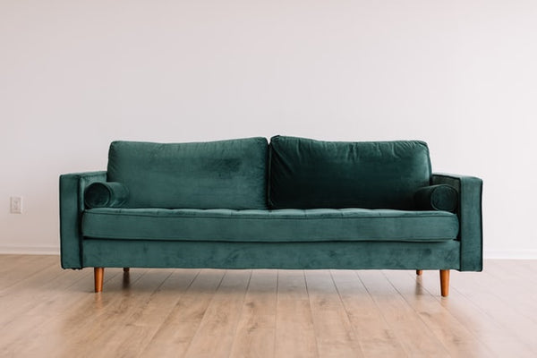 Teal sofa with track arms