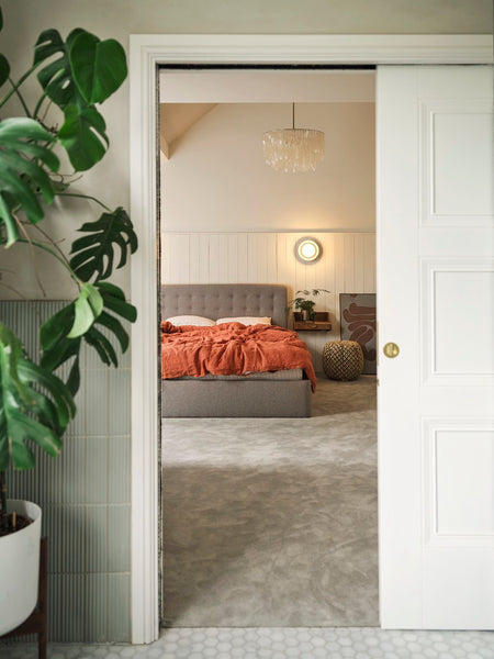 bedroom with sconce wall light