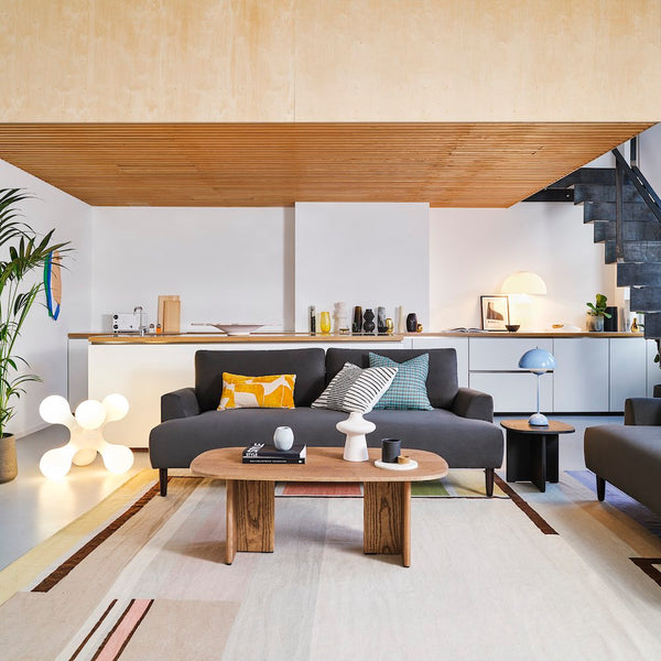 black sofa in loft style apartment