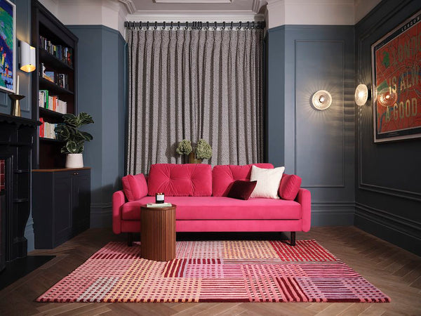 pink sofa with pink rug