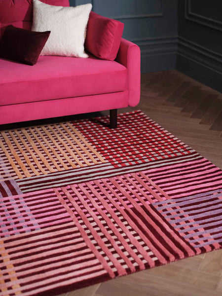 pink rug with basket weave pattern