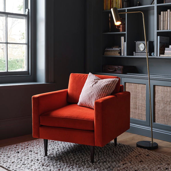 red velvet accent chair with reading lamp