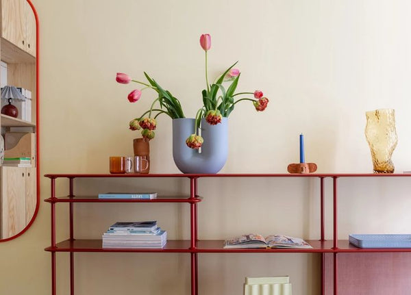 Sideboard with tulips in vase