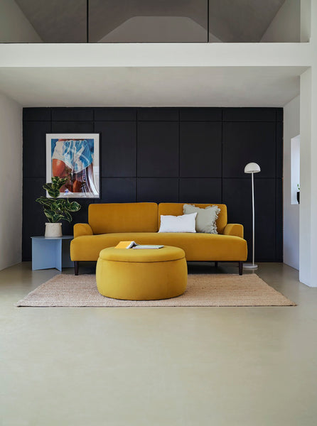 curved sofa and round ottoman