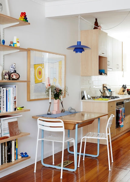 scandi style kitchen with blue pendant light