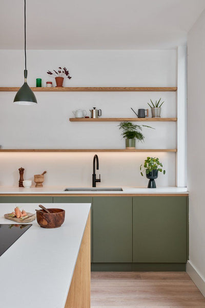 green kitchen with open shelving