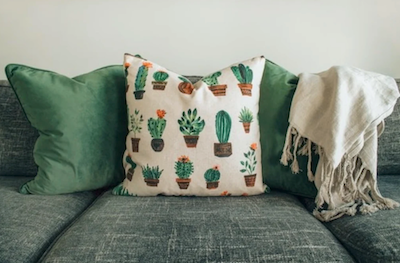 Green sofa and cushions