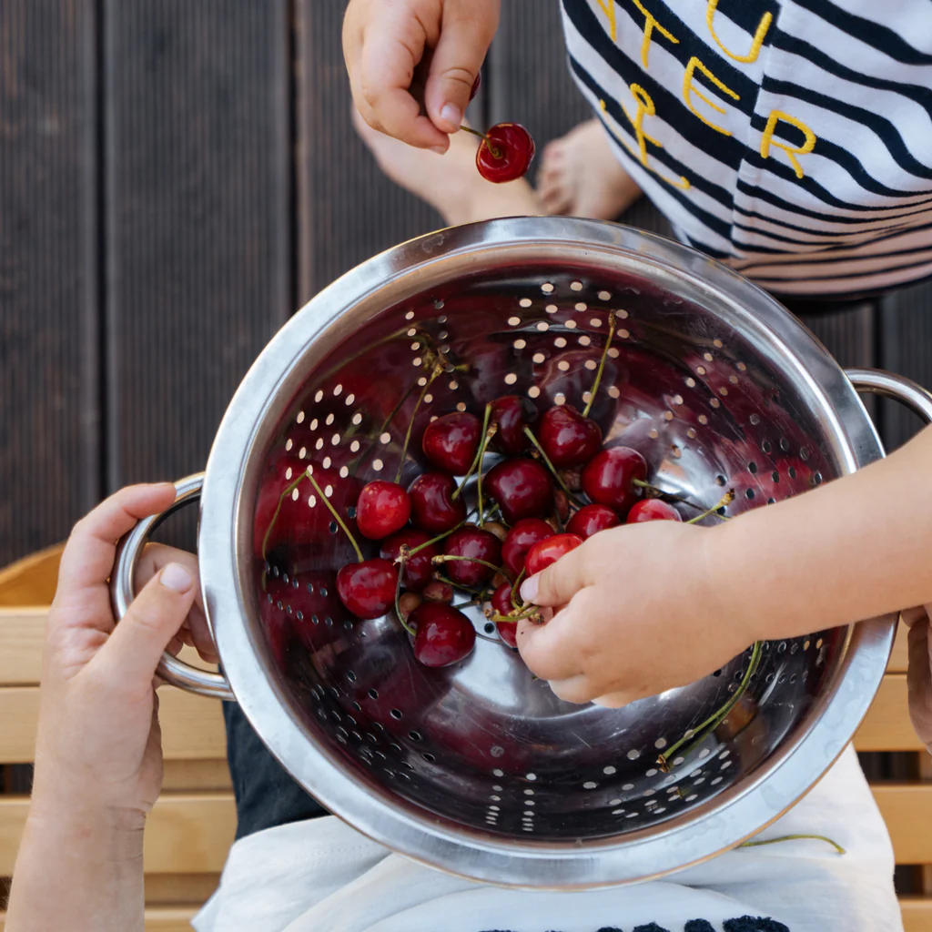 A colander of fresh cherries 