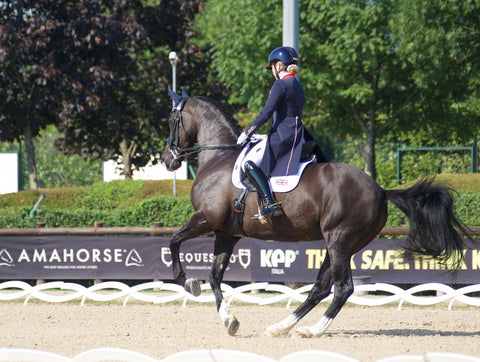 Rebecca Bell riding a horse during a competition