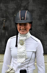 A smiling Natasha Rumble dressed in formal riding gear