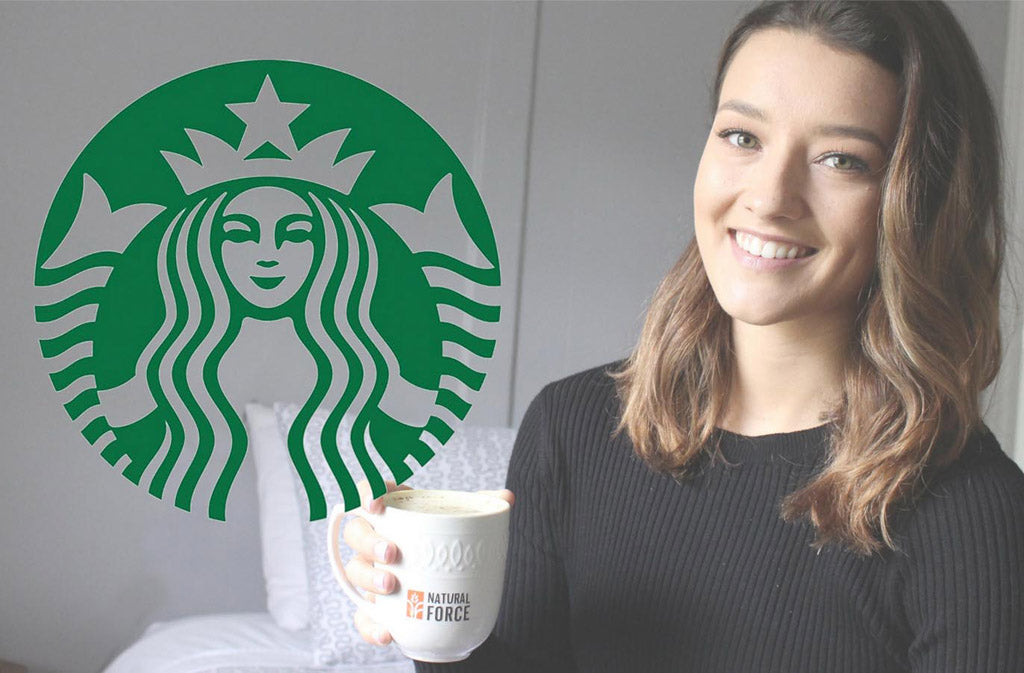 starbucks logo and woman smiling holding white natural force mug