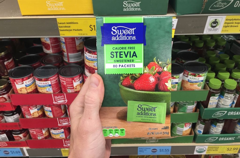 hand holding a package of stevia