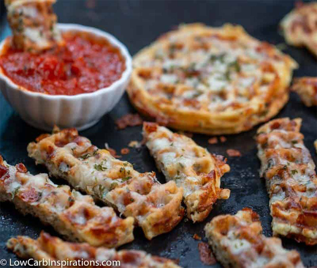 cheesy garlic bread chaffles with a bowl of marinara sauce