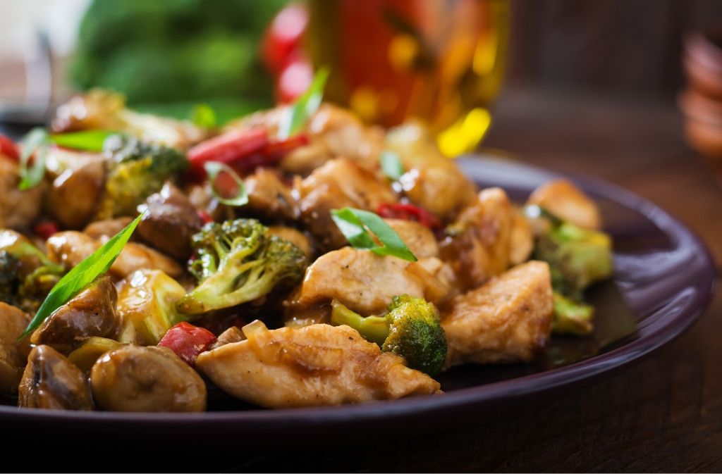 a plate of keto friendly chinese steamed chicken and vegetables