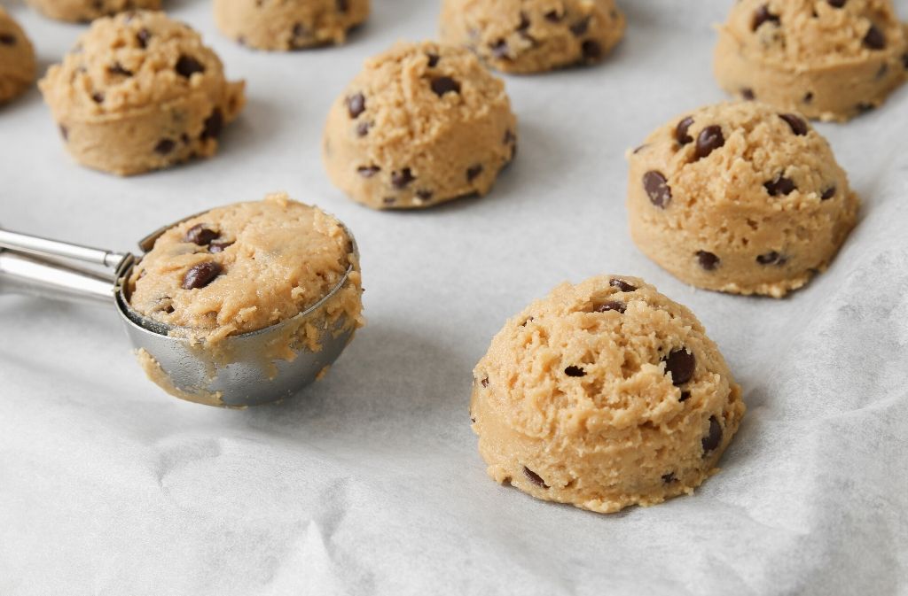 keto cookie dough balls on a piece of parchment paper