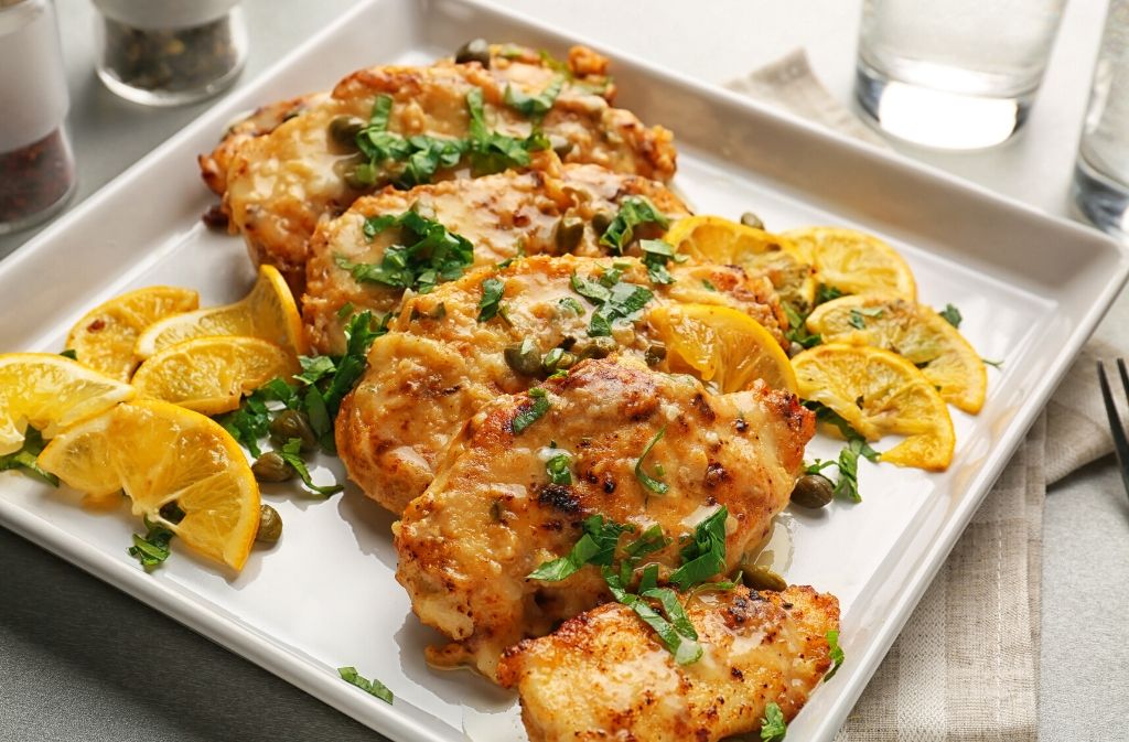 square white plate of keto chicken piccata