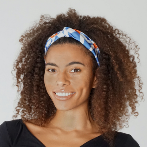 woman in daisy print twist knot headband 