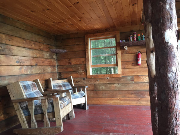 A cabin located in the forested mountains of Lake George, New York