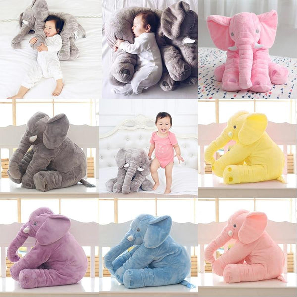 baby with elephant pillow