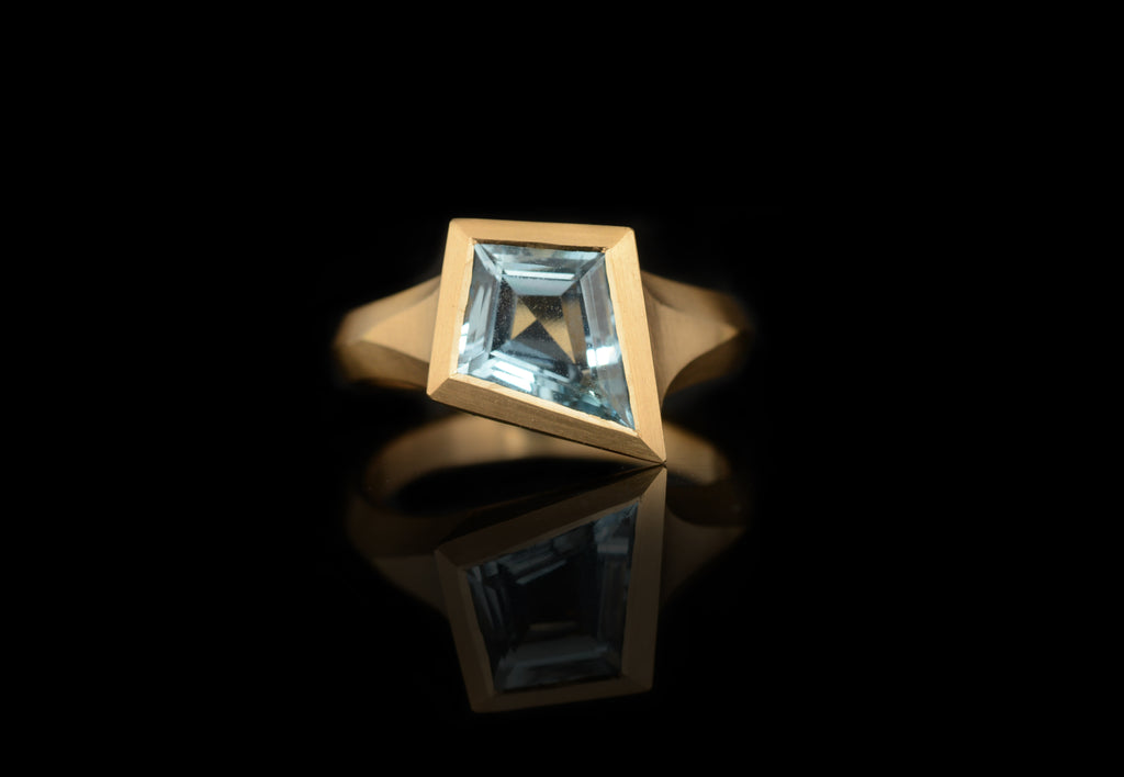 kite shaped aquamarine yellow gold aegis carved ring