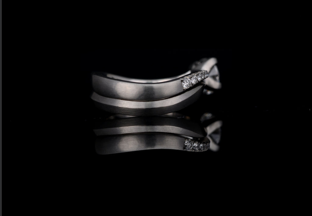 Platinum solitare engagement ring with matching wedding band.