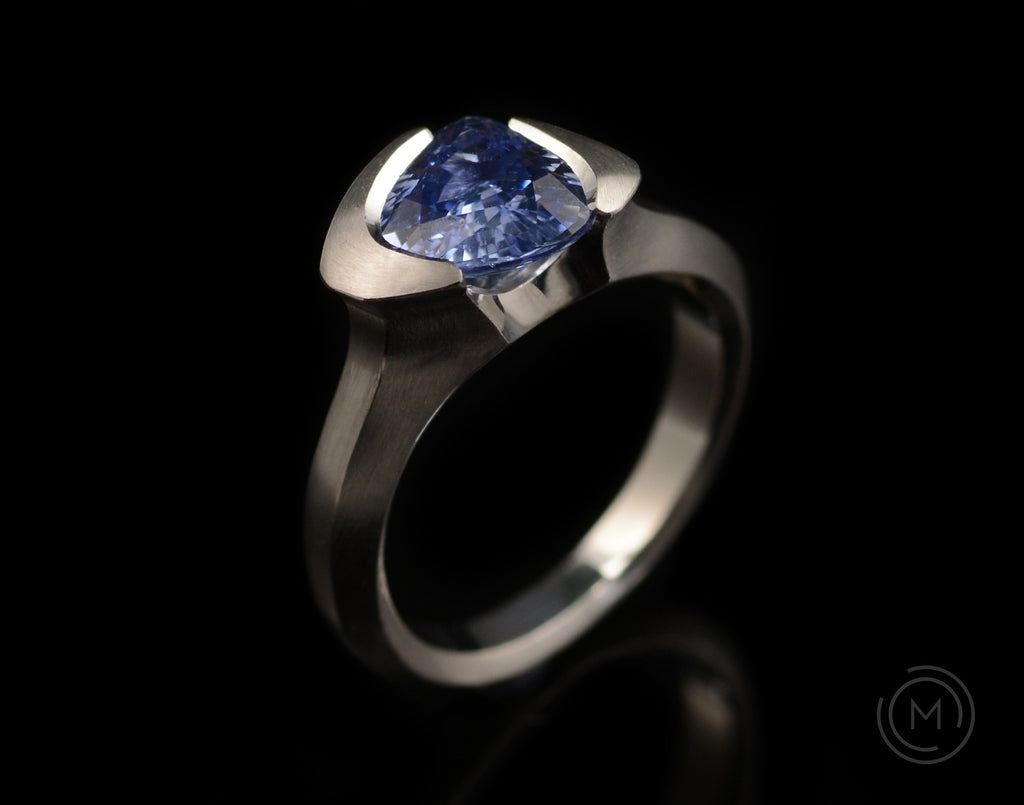 Bespoke sapphire and platinum hand-carved Arris ring