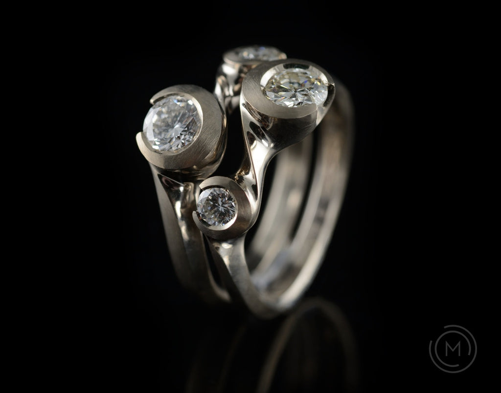 Bespoke Arris hand-carved platinum and diamond interlocking ring set