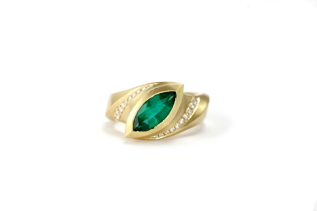 marquise emerald and yellow gold arris ring with pave set diamonds