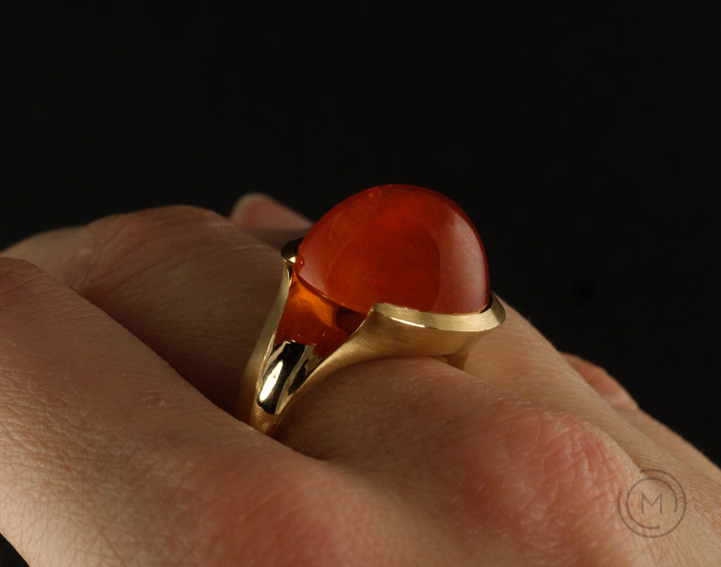 Rose gold hand-carved Arris ring with large cabochon garnet