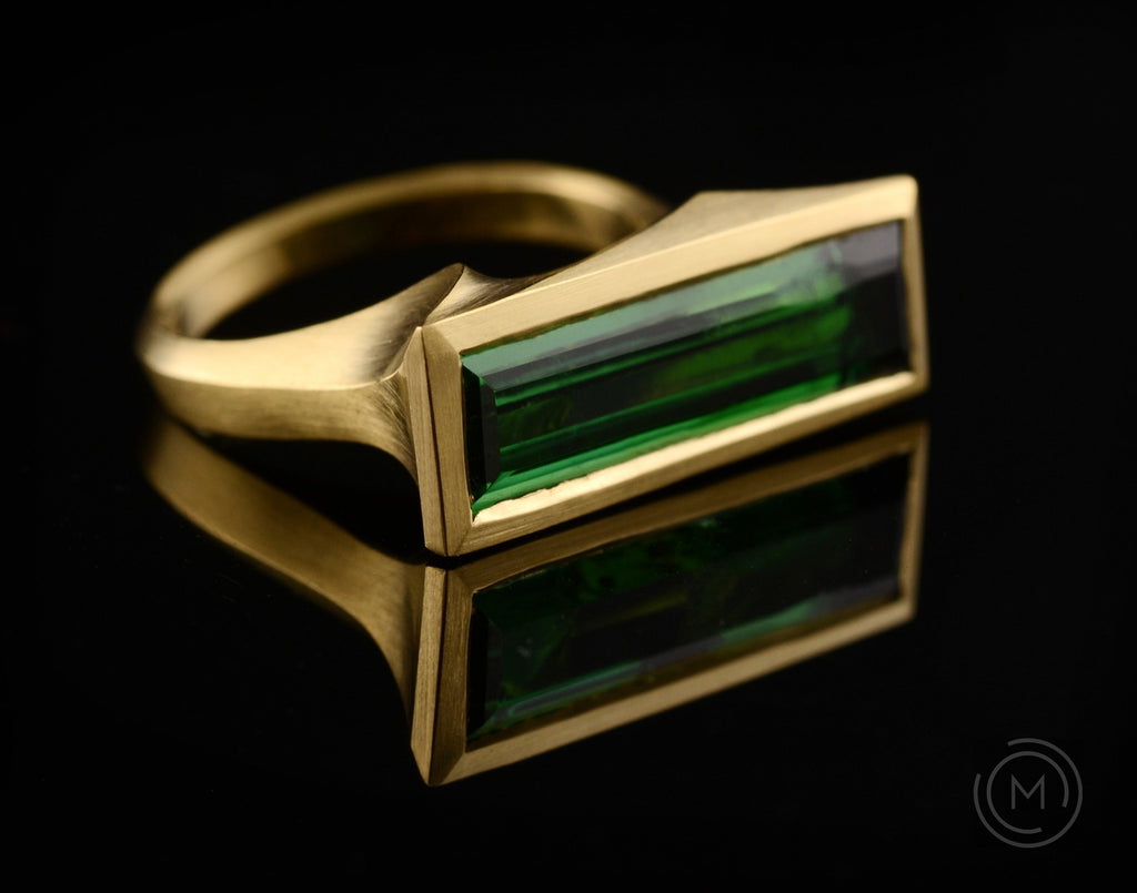 Arris hand-carved gold cocktail ring with green baguette tourmaline