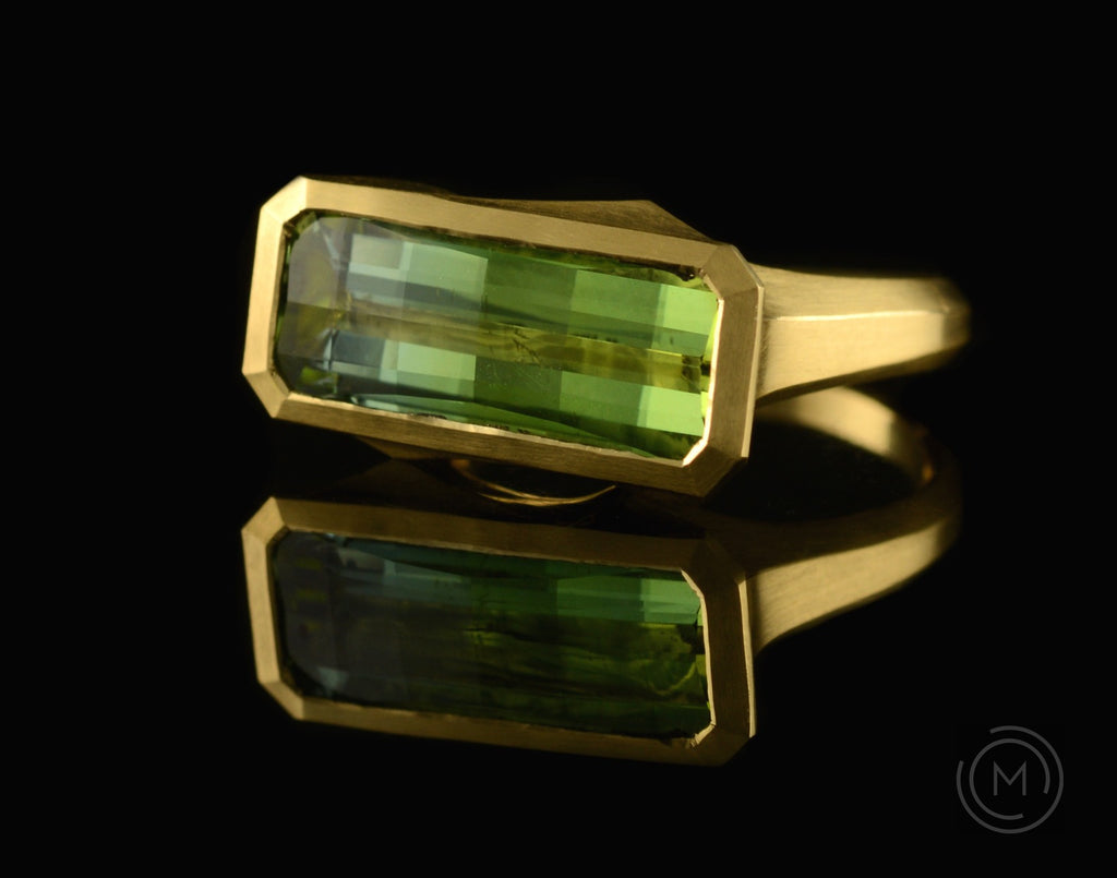 Arris hand-carved cocktail ring with fancy green tourmaline