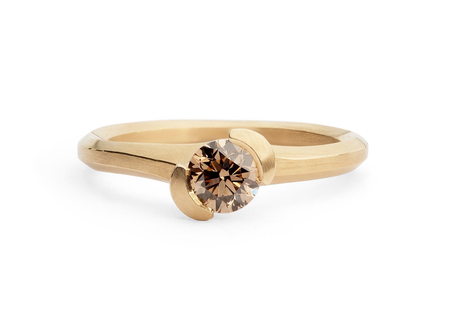 Hand carved asymmetrical Arris engagement ring with cognac diamond