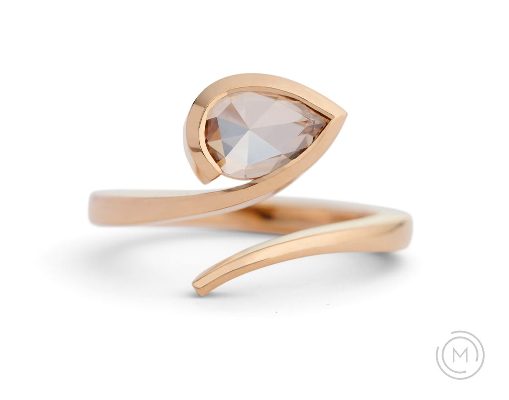 Rose gold contemporary engagement ring with pear cognac diamond